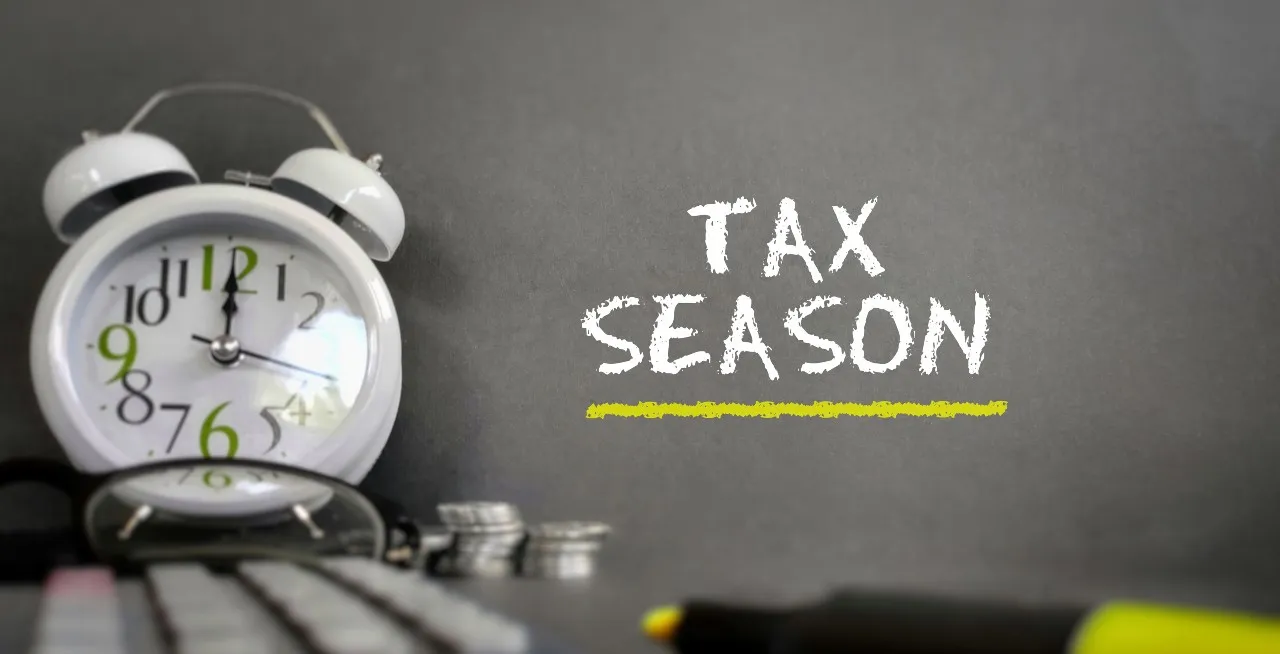 clock and highlighter with reminder tax season is here